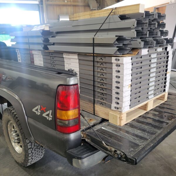 A truck loaded up with door frame hardware.